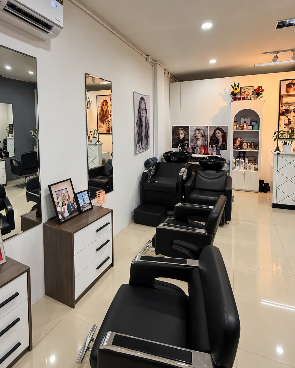Black styling chairs and mirrors at Salon Rawai